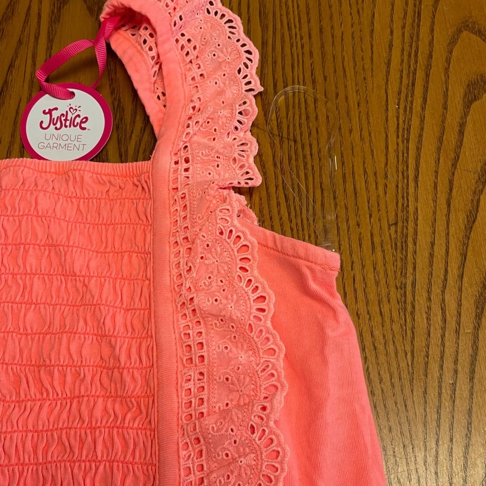 New Justice Girls orange smocked ruffle orange dye top. Size L 12/14